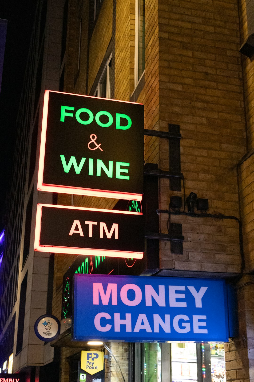 food-wine-atm-and-money-change-signs-at-night-41vzghevg6i